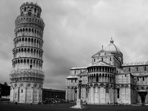 Leaning Tower of Pisa beside the Pisa Cathedral under a cloudy sky
