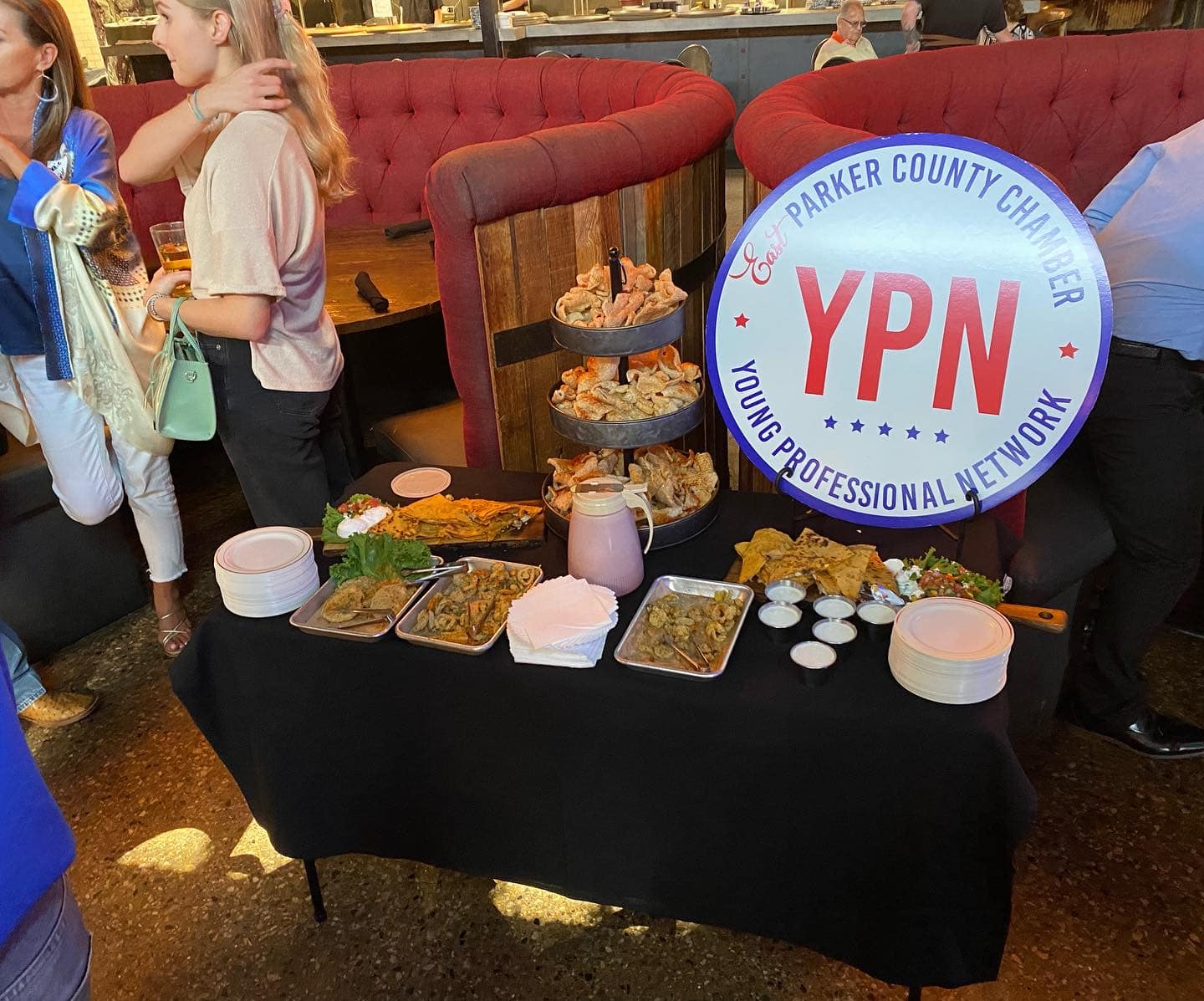A table with food and a sign that says ypn