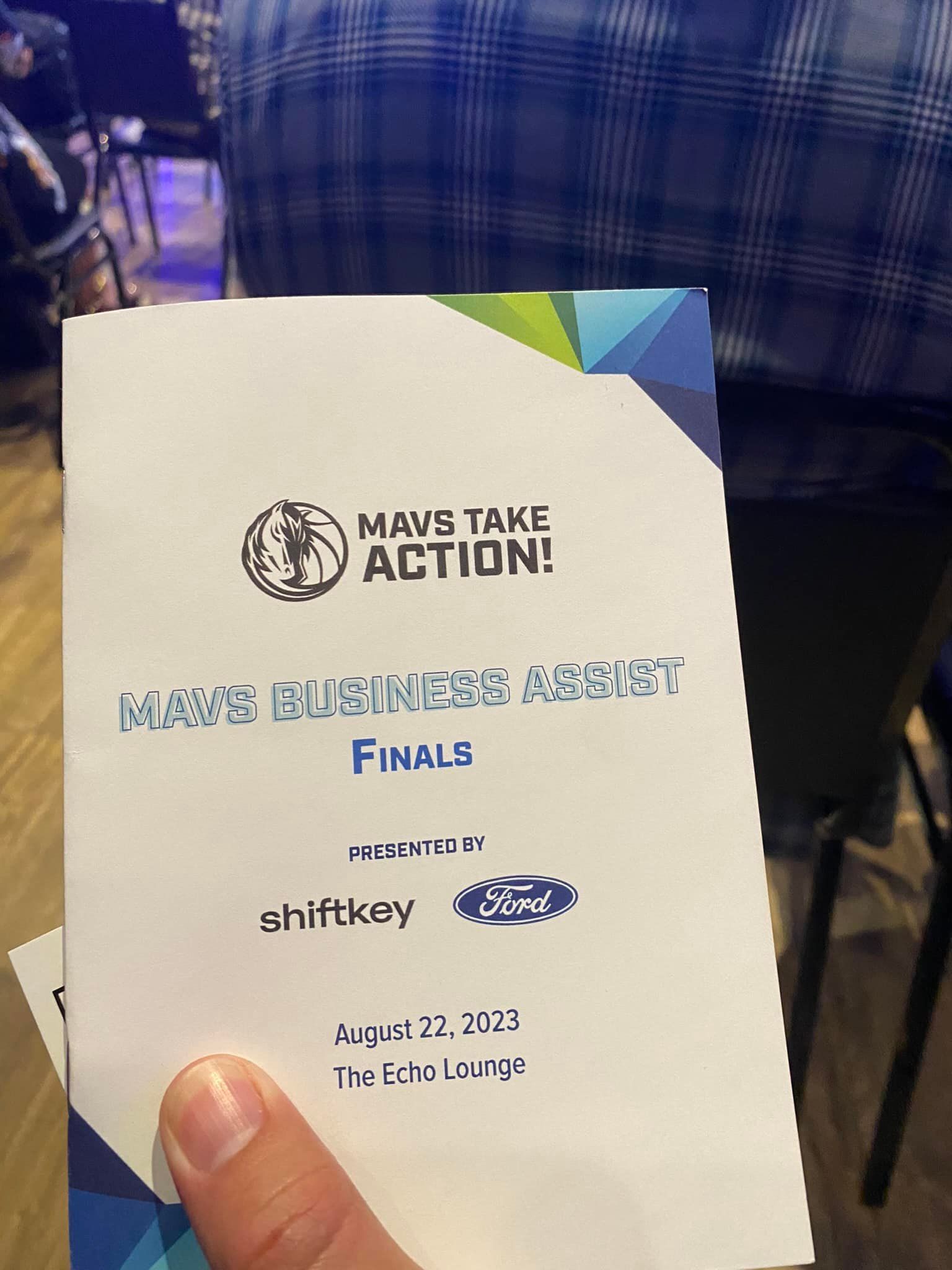 A person is holding a piece of paper that says maybe take action