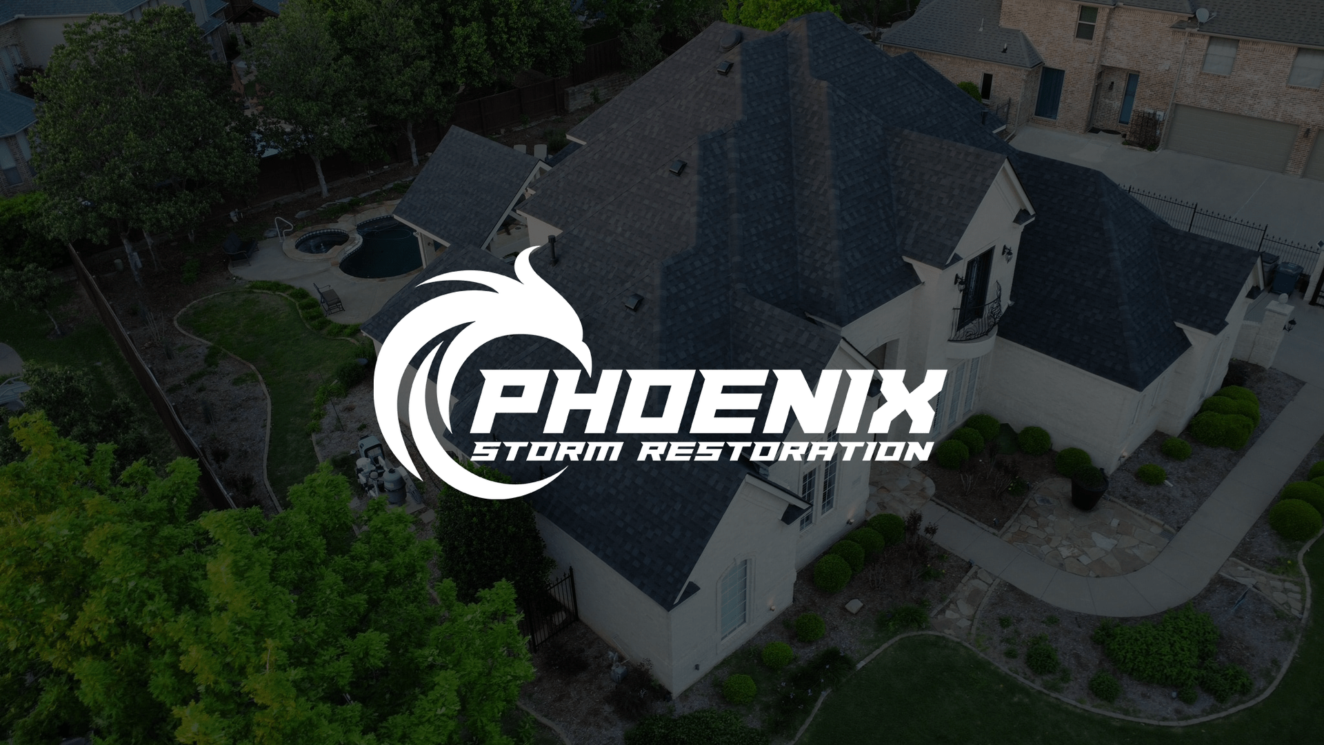 Overhead view of a house with the Phoenix Storm Restoration logo overlaid on top.