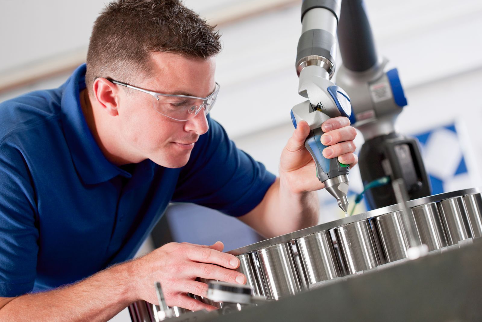 Quality engineer inspecting a precision machined part
