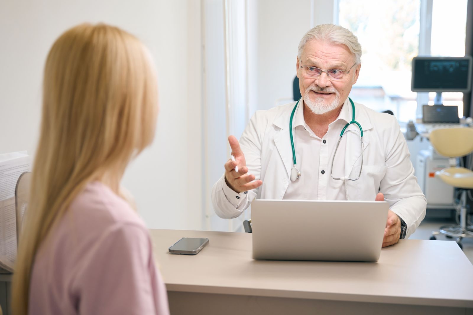 Doctor discussing results with a patient in an exam office