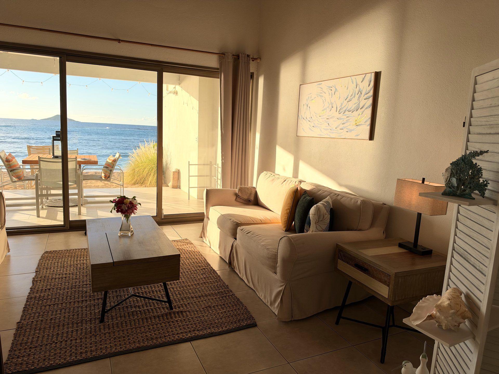 1 Bedroom Beachfront Suite lounge opening onto the beach
