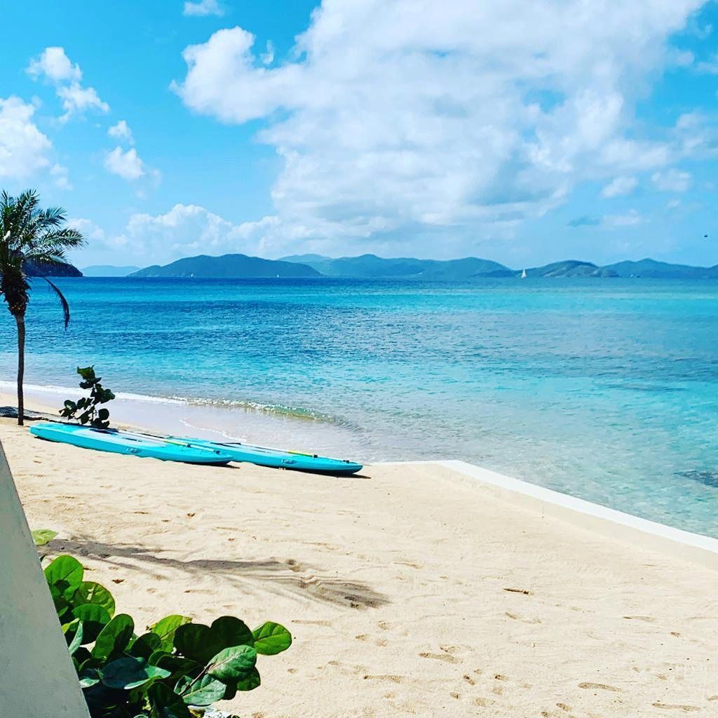 Kayaks and paddleboards on the beach at Mango Bay, Virgin Gorda
