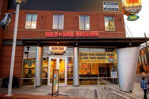 A large brick building with a sign that says rock n ' soul reach out.