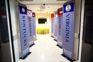 A hallway with signs for kentucky , georgia , mississippi and alabama