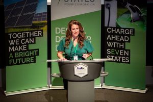 A woman is standing at a podium giving a speech.