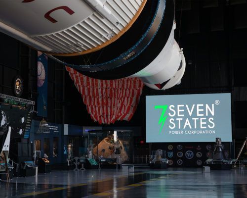A large screen with the words seven states on it
