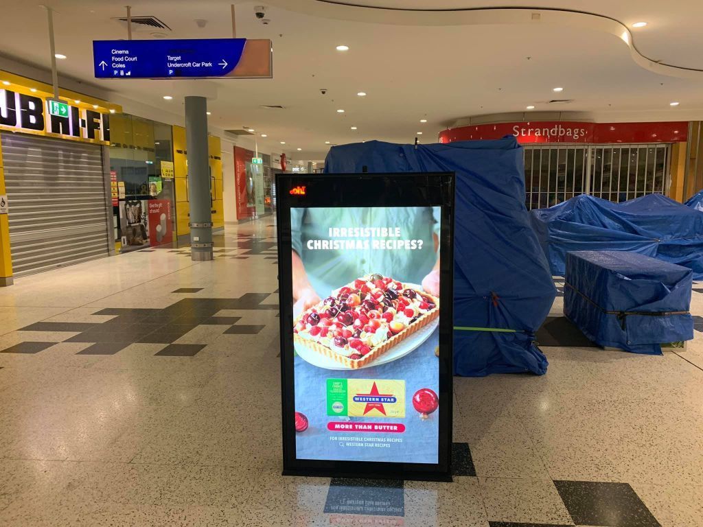 A Sign In A Shopping Mall Advertising A Pizza — Cairns Signcorp In Mission Beach, QLD