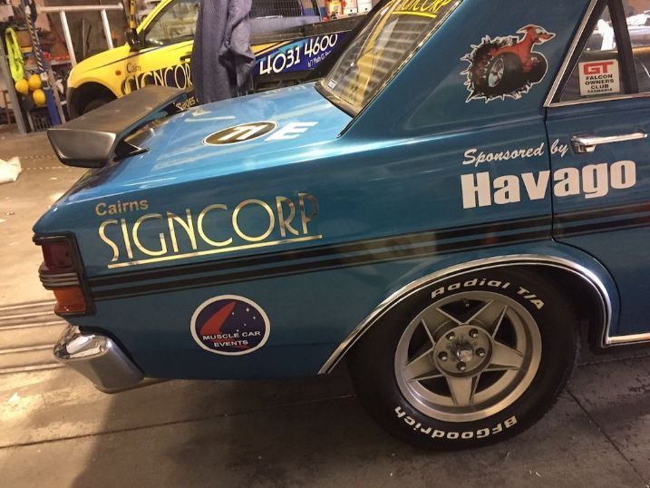A Blue Car With The Word SignCorp On The Side — Cairns Signcorp In Portsmith, QLD