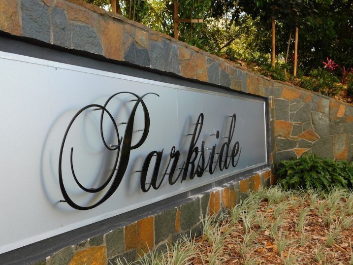 A Sign For Parkside Is On A Stone Wall — Cairns Signcorp In Portsmith, QLD