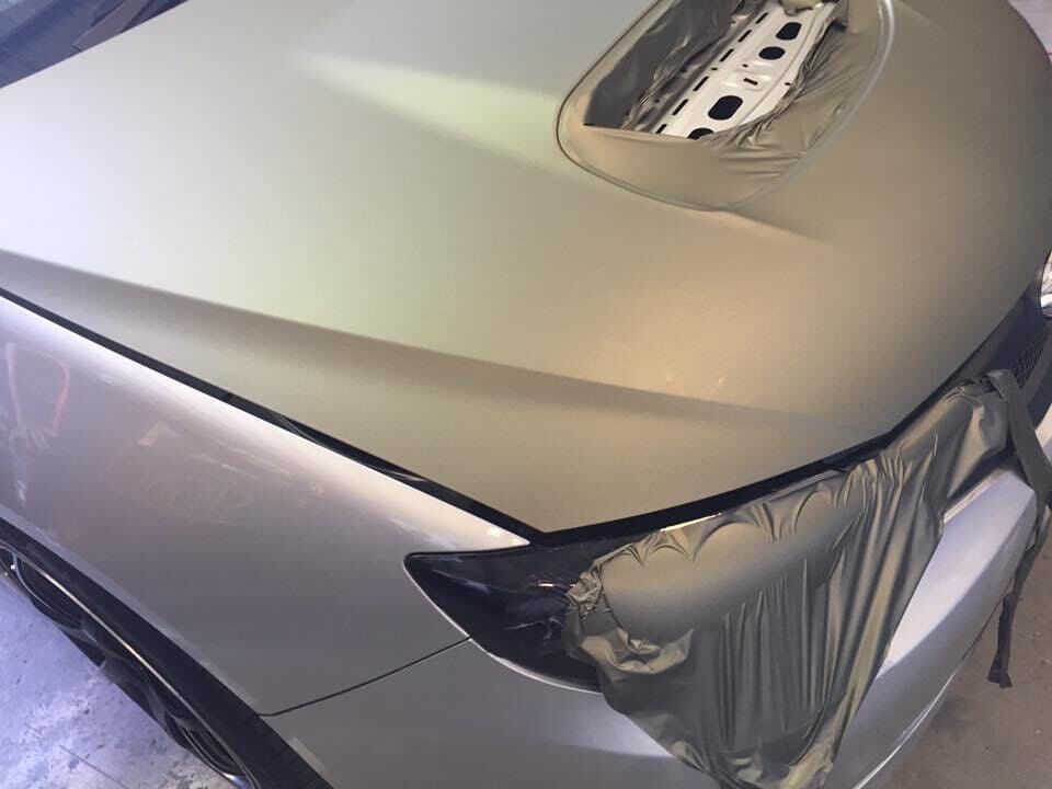 The Hood Of A Silver Car Is Wrapped In Plastic — Cairns Signcorp In Portsmith, QLD