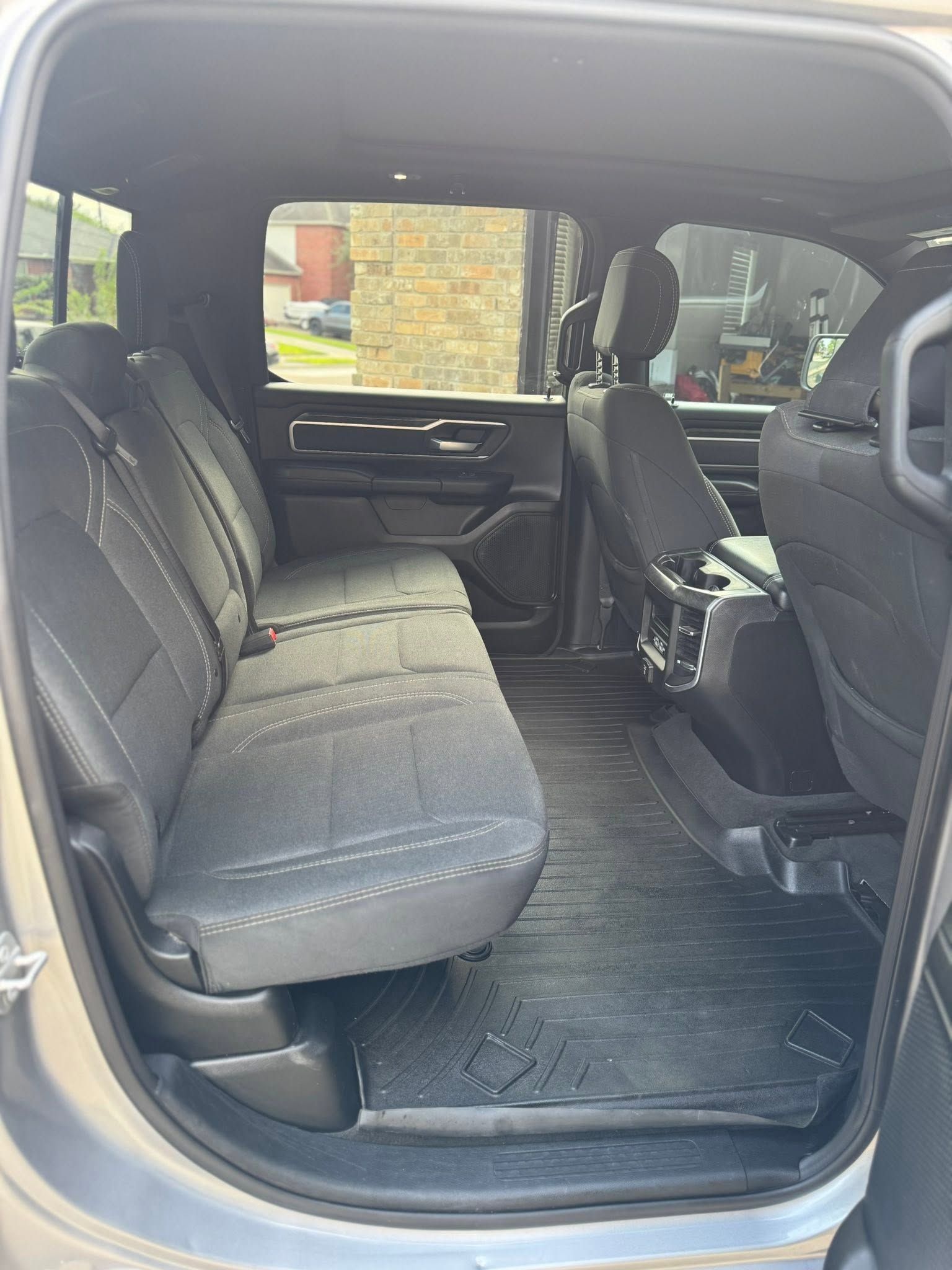 Black leather Toyota car interior with steering wheel, center console, and front seats