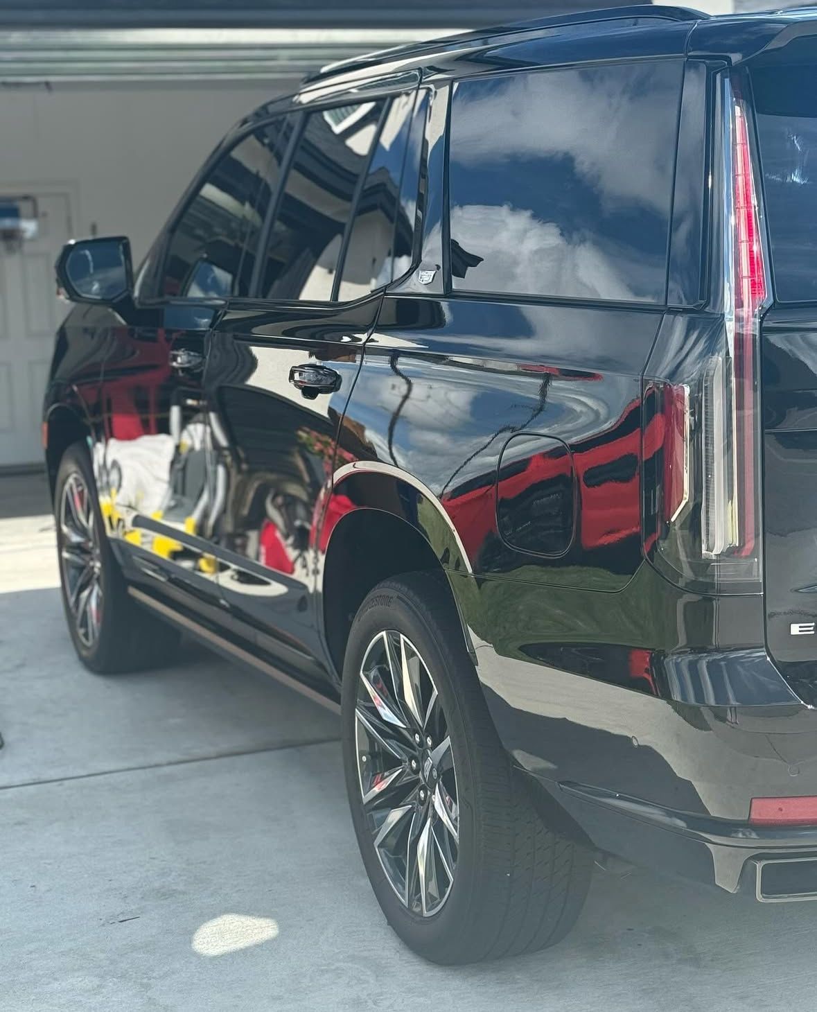 Black leather Toyota car interior with steering wheel, center console, and front seats