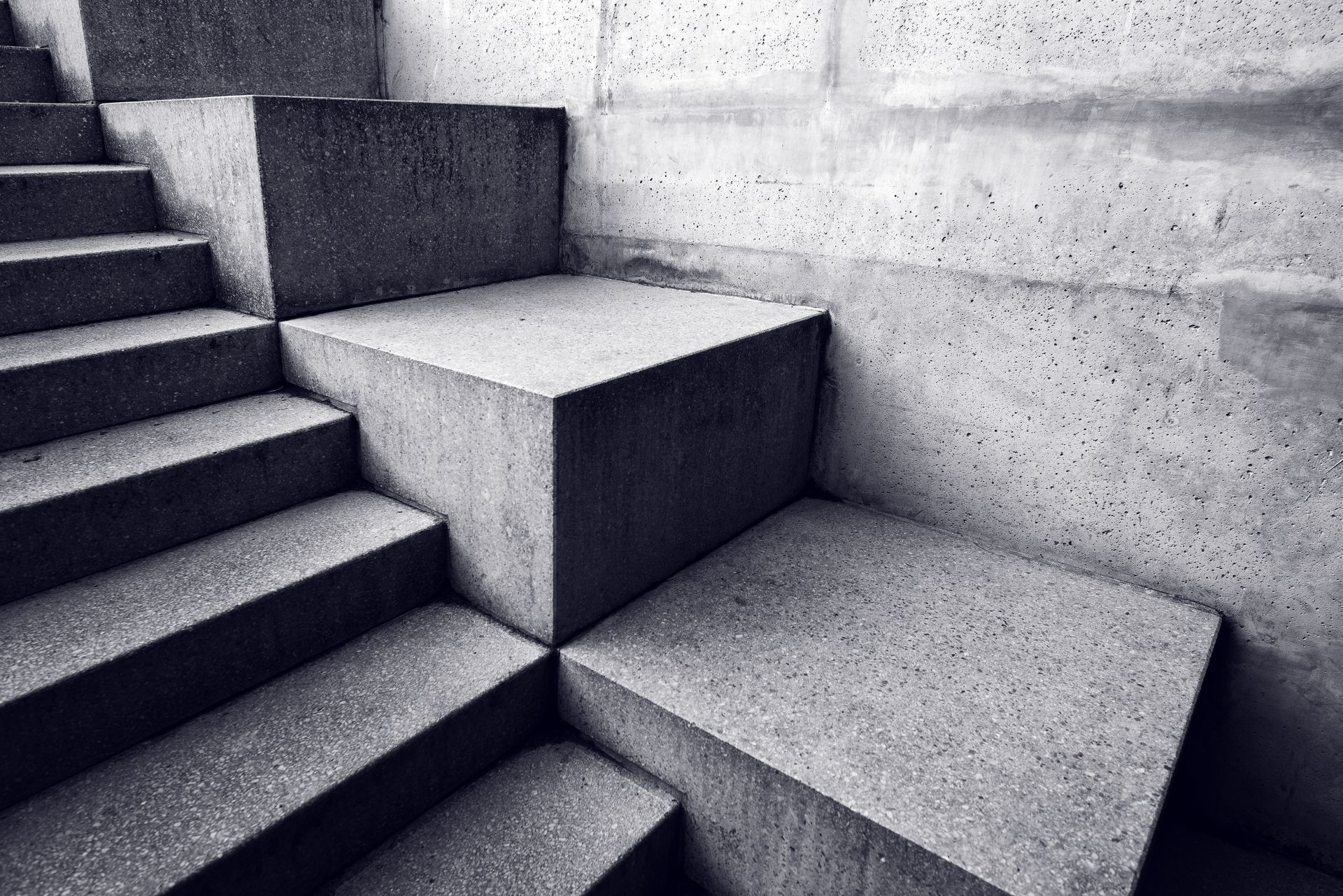 A black and white photo of a set of concrete stairs.