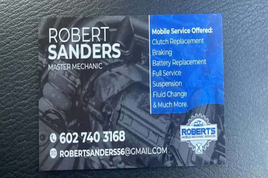 Business card for Robert Sanders, master mechanic, with blue service list and contact info.