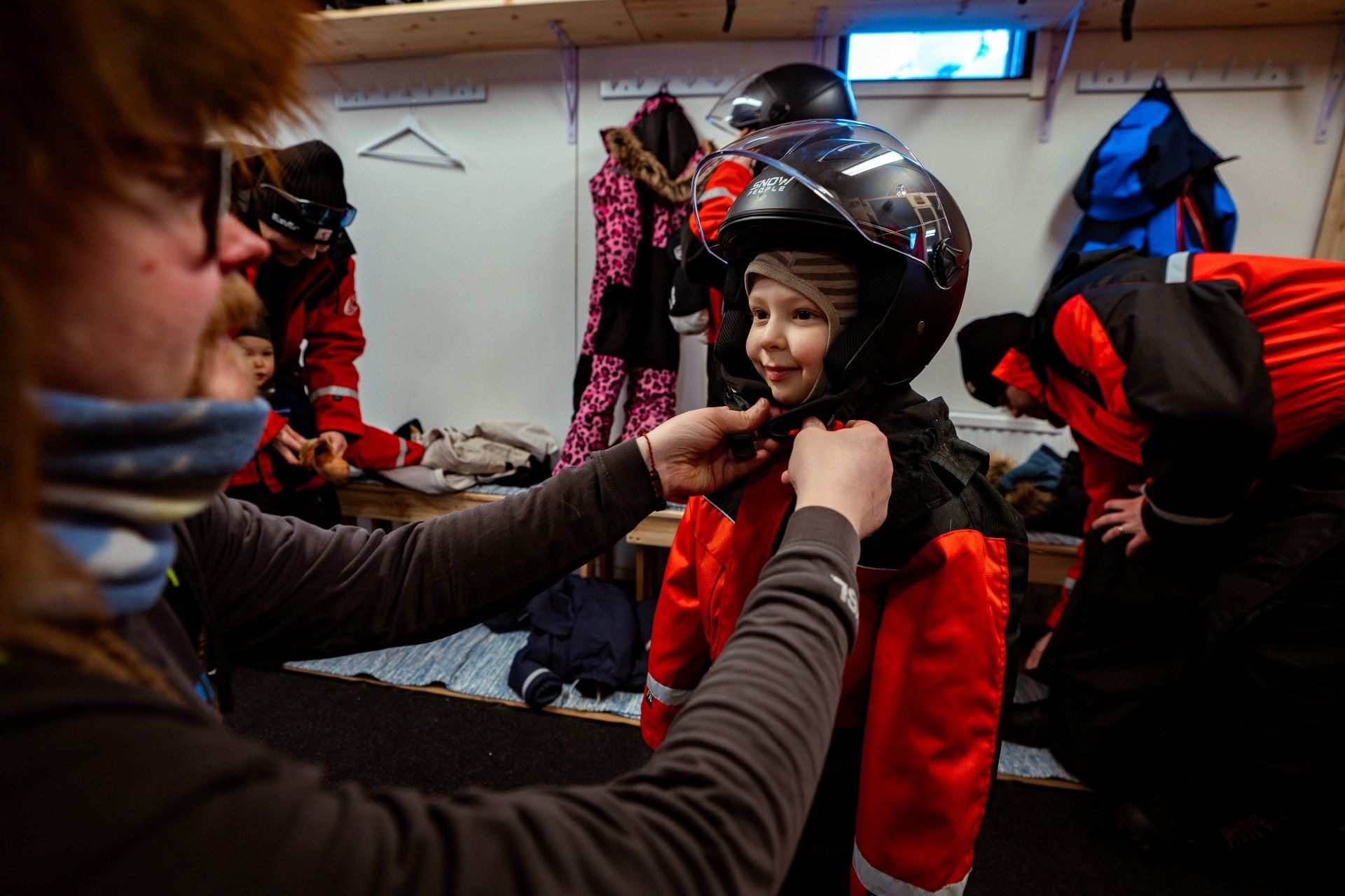 Kids dressing for snowmobile safari