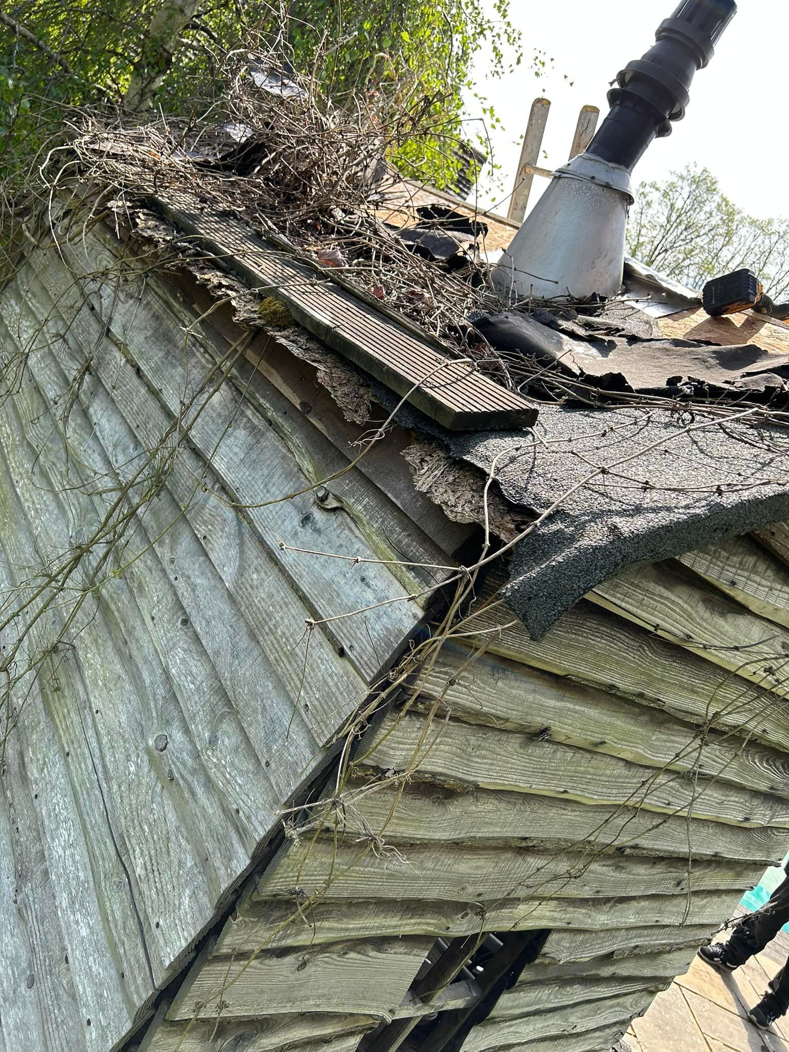 A roof in need of repair with rotted wood to replace