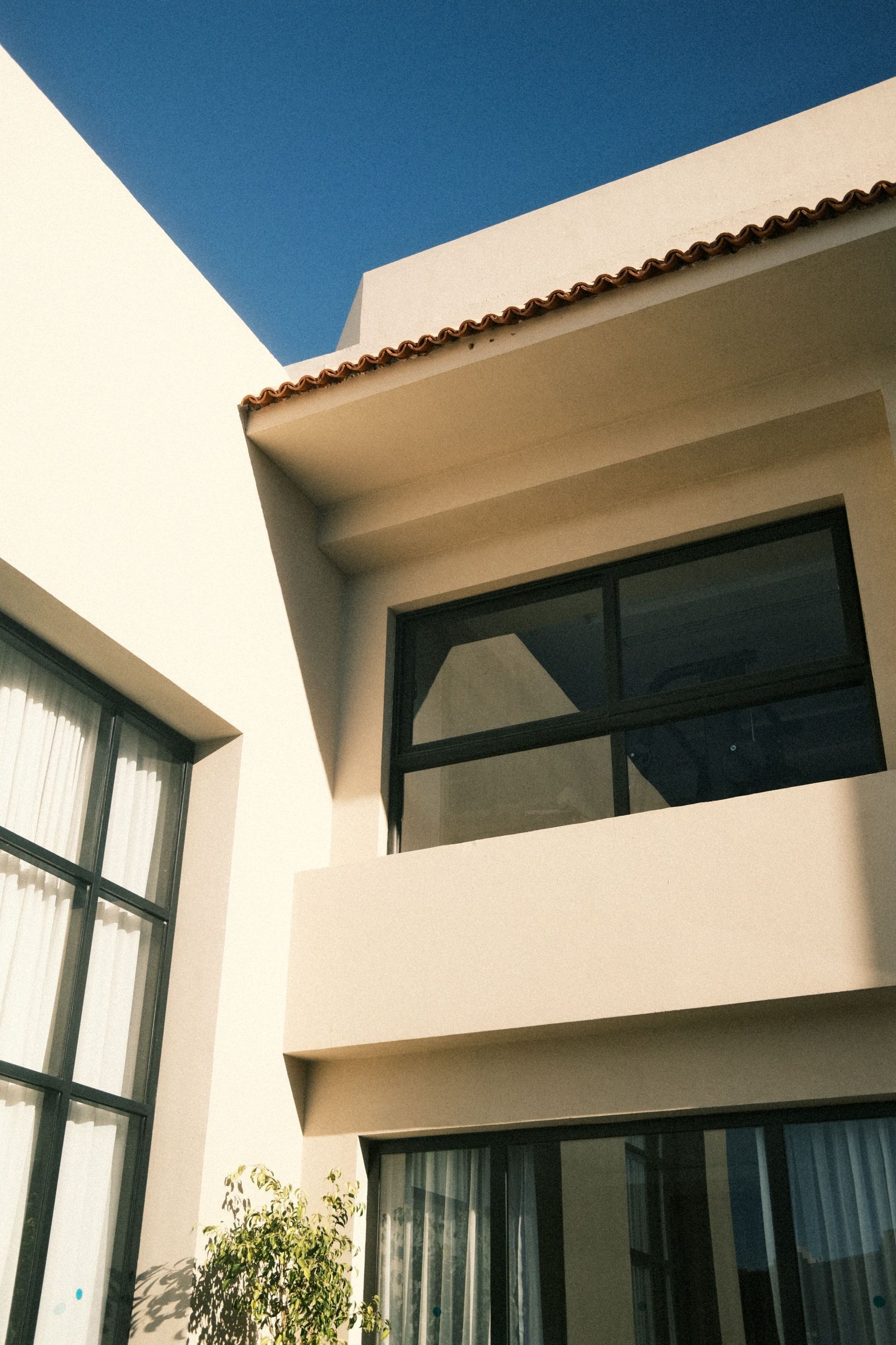 Modern building exterior under a blue sky