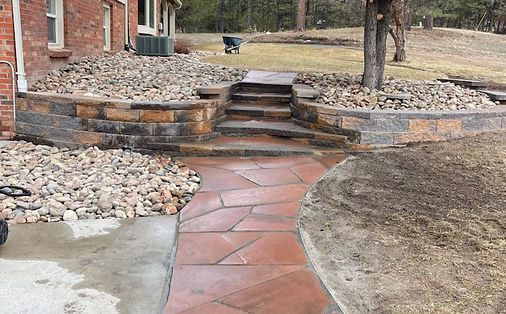 A stone walkway with stairs leading up to a house