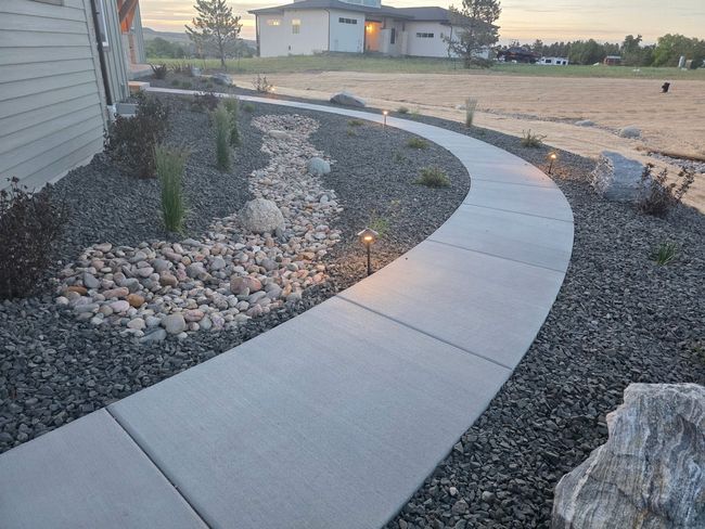 A Fire Pit is Sitting on a Patio 