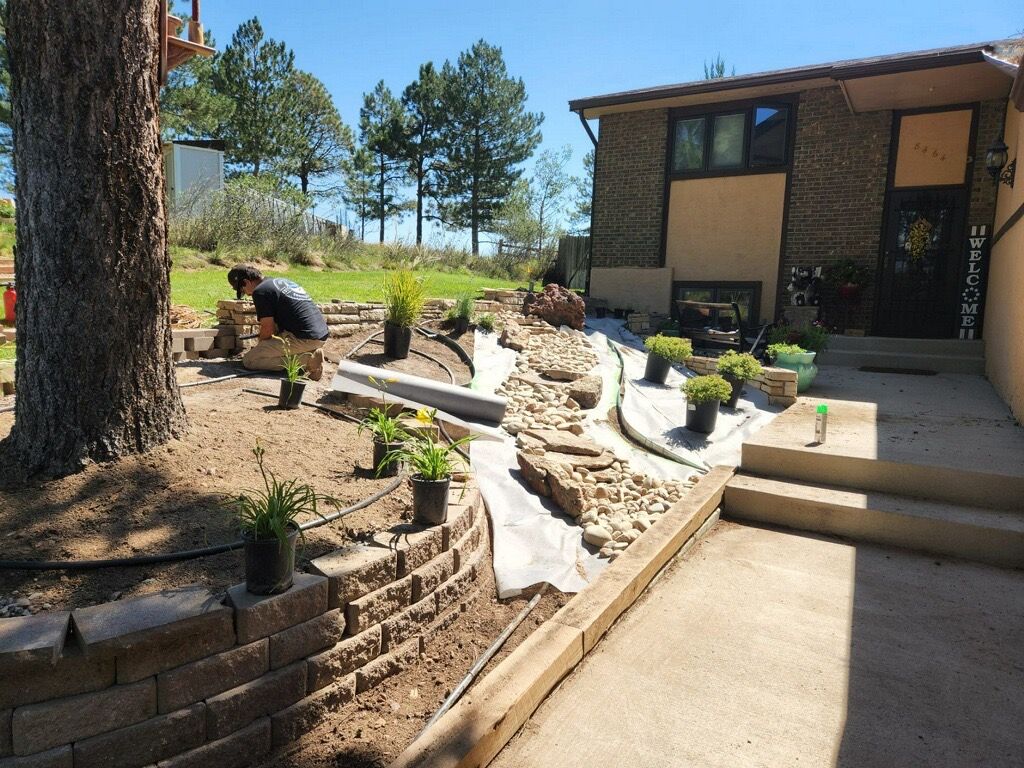 There is a Brick Walkway in the Middle of the Garden