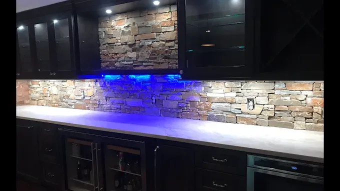 Tile samples with various textures and colors arranged in a display.
