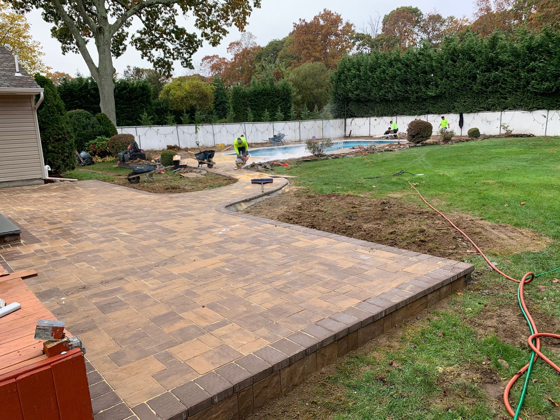 A Patio Build on the Side of the Pool — Westbury, NY — A&M D’Alessandro Contractors Inc.