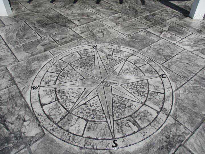 Stamped concrete patio with compass rose design.
