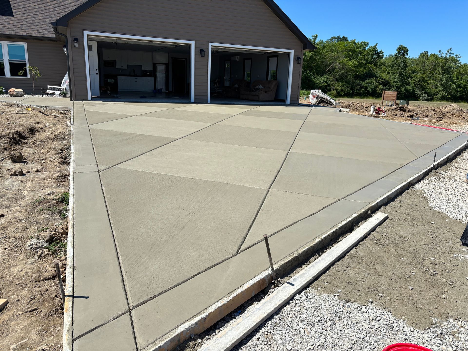 New concrete driveway installation with decorative saw cuts completed by D & M Concrete in Fort Wayne Indiana