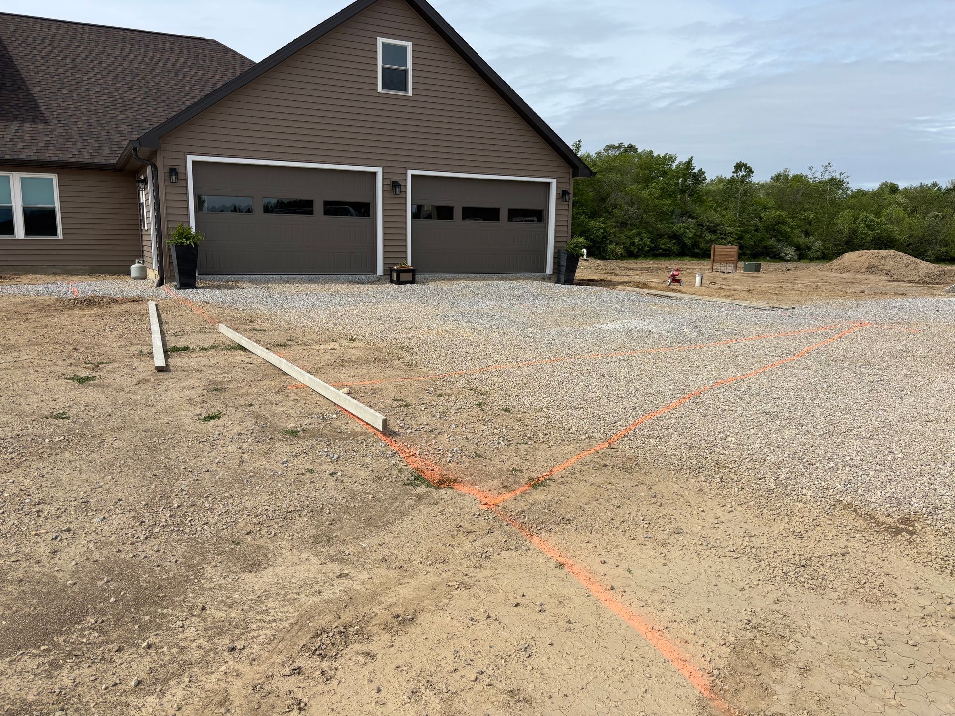 Concrete driveway layout and site preparation before installation by D & M Concrete in Fort Wayne Indiana