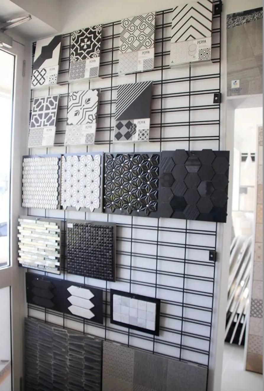 A Wall With a Lot of Tiles on It — Traditional Tiles & Flooring In Cairns, QLD