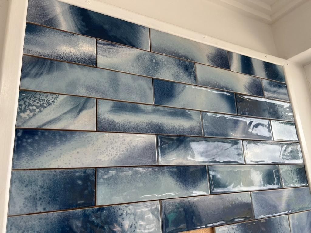 A Wall With a Lot of Blue Tiles on It — Traditional Tiles & Flooring In Woree, QLD