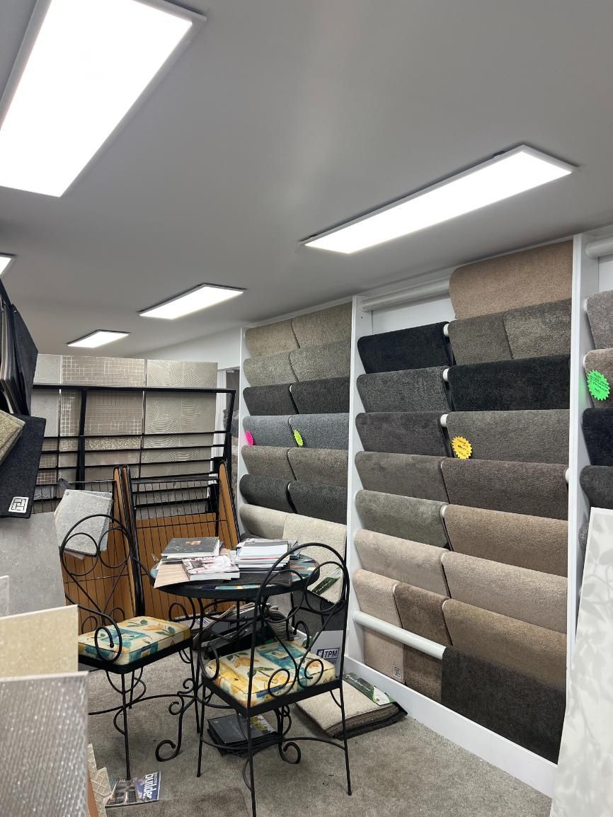 A Room Filled With Lots of Carpets and a Table and Chairs — Traditional Tiles & Flooring In Douglas Shire, QLD