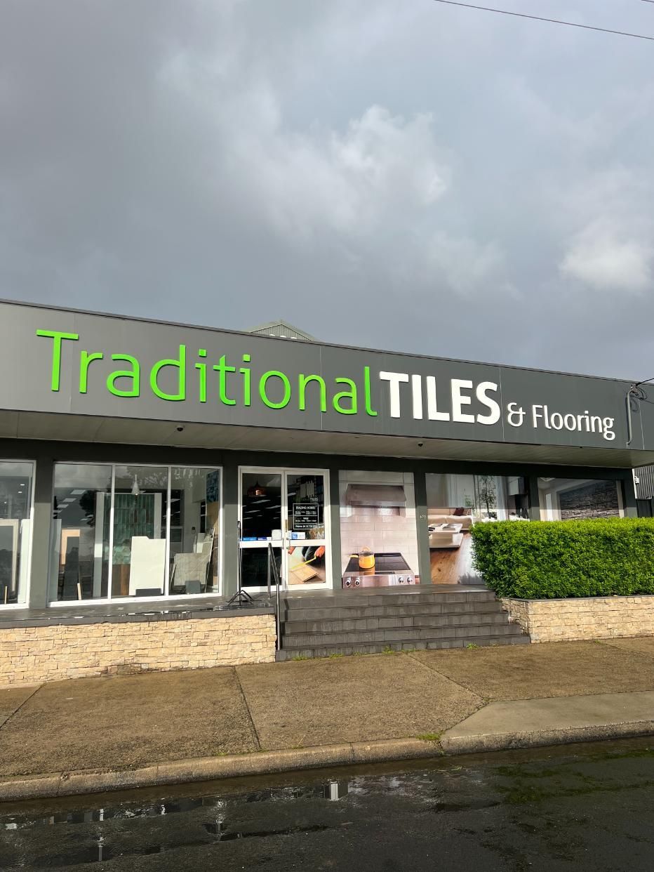 A Building With a Sign That Says Traditional Tiles and Flooring on It — Traditional Tiles & Flooring In Tablelands, QLD