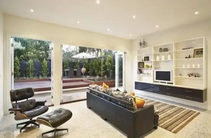 Aa Living Room With a Couch, Chair and Television — Traditional Tiles & Flooring in Redlynch, QLD