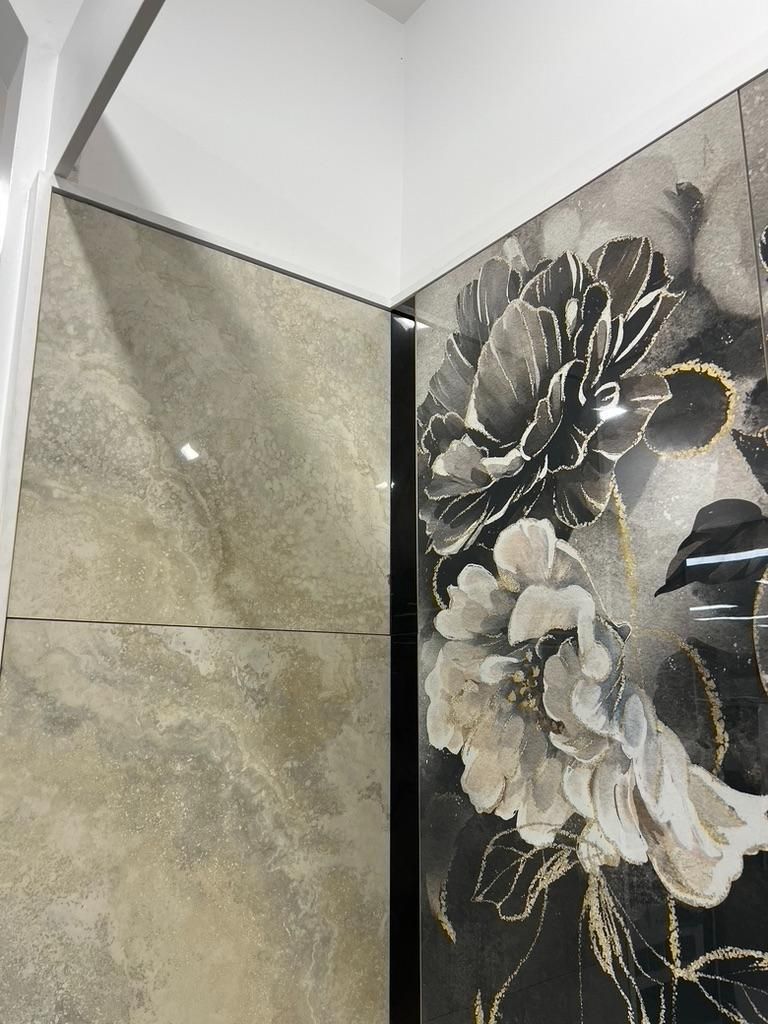 A Tiled Wall With a Picture of Flowers on It — Traditional Tiles & Flooring in Redlynch, QLD