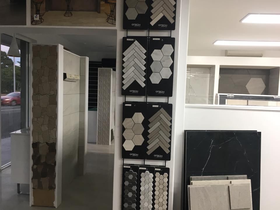 A Display of Tiles Hanging on a Wall in a Store — Traditional Tiles & Flooring In Tablelands, QLD