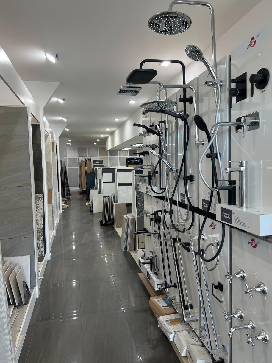 A Store Filled With Lots of Shower Heads and Faucets — Traditional Tiles & Flooring in Bentley Park, QLD