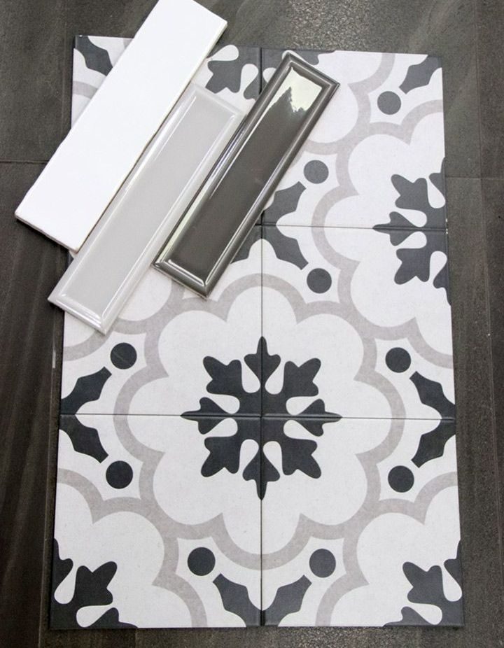 A Black and White Tile with A Snowflake Pattern — Traditional Tiles & Flooring In Woree, QLD