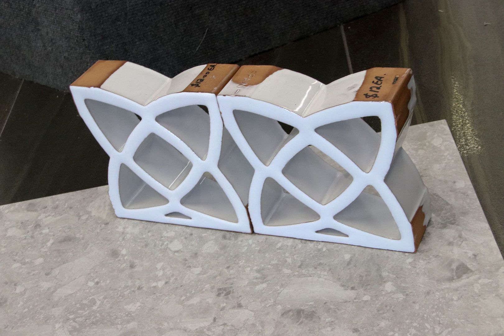 A Pair of White Boxes with A Wooden Border Are Sitting on A Table — Traditional Tiles & Flooring In Woree, QLD
