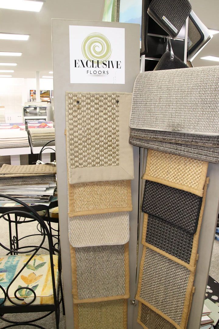 A Display of Fabrics in A Store with A Sign that Says Exclusive — Traditional Tiles & Flooring In Woree, QLD