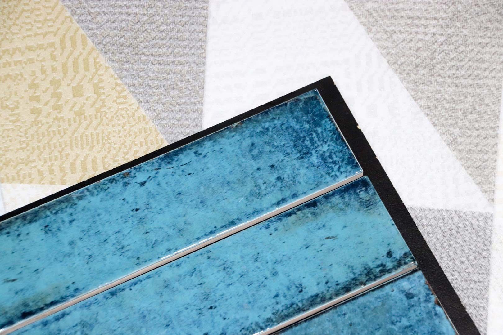 A Close up Of a Blue Tile on A Rug — Traditional Tiles & Flooring In Woree, QLD