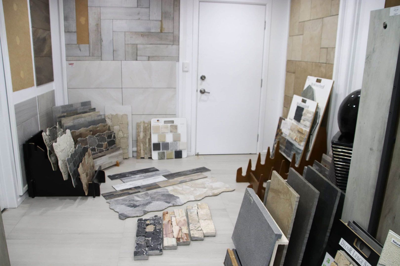 A Room Filled with Lots of Tiles and A Door — Traditional Tiles & Flooring In Woree, QLD
