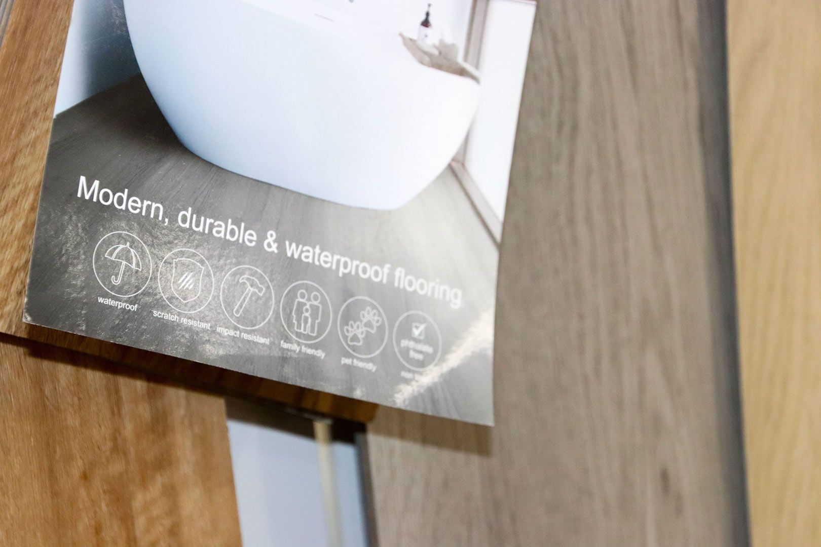 A Brochure for Flooring Is Sitting on A Wood — Traditional Tiles & Flooring In Woree, QLD