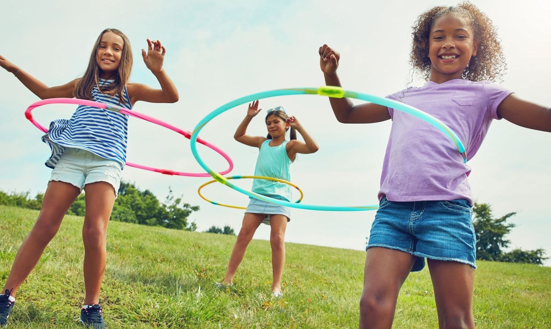 Children playing with hula hoops.