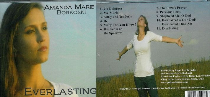 Album cover for Amanda Marshall’s Everlasting, featuring a woman in white with arms outstretched and track list on the back