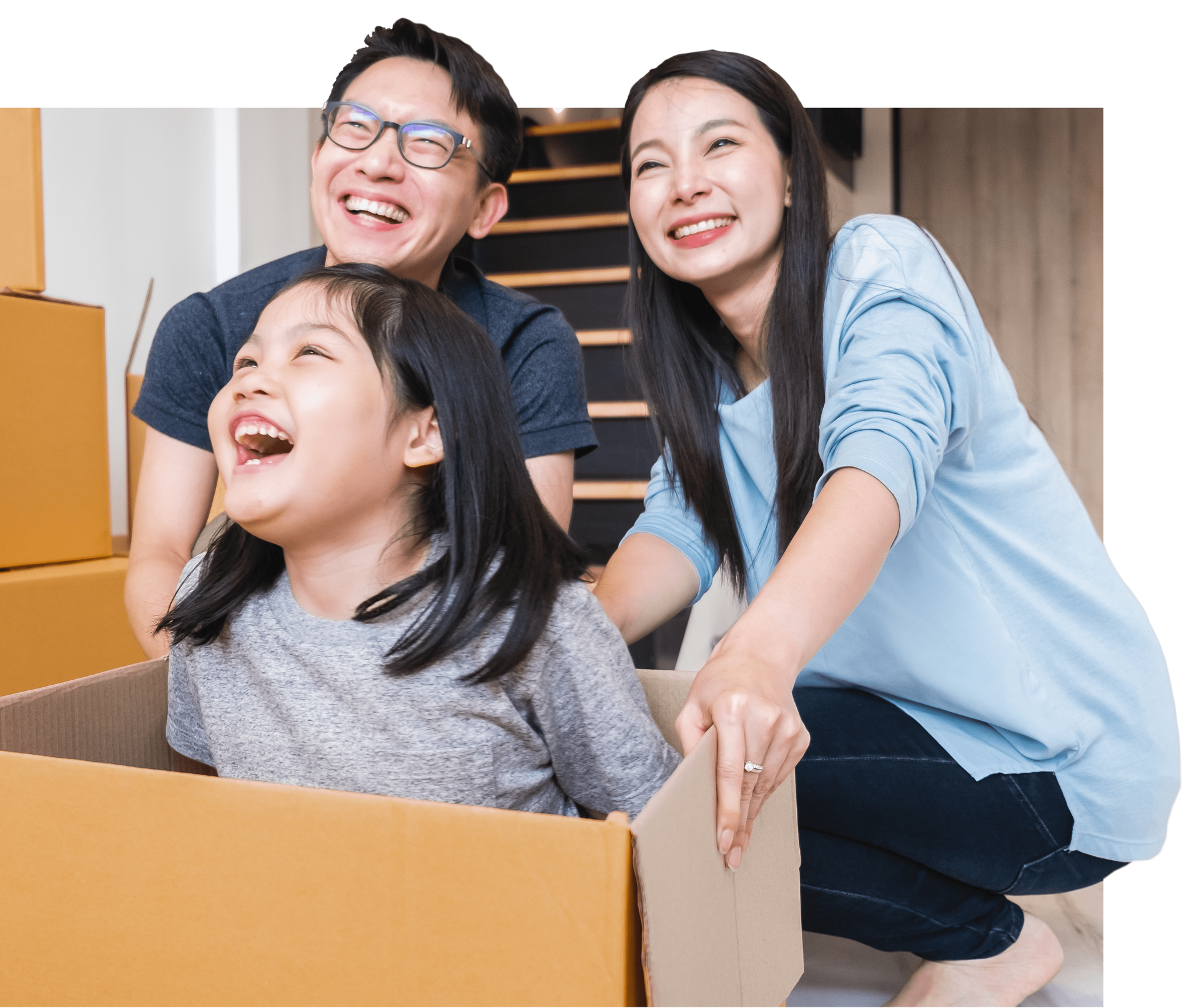 A family is playing in a cardboard box.