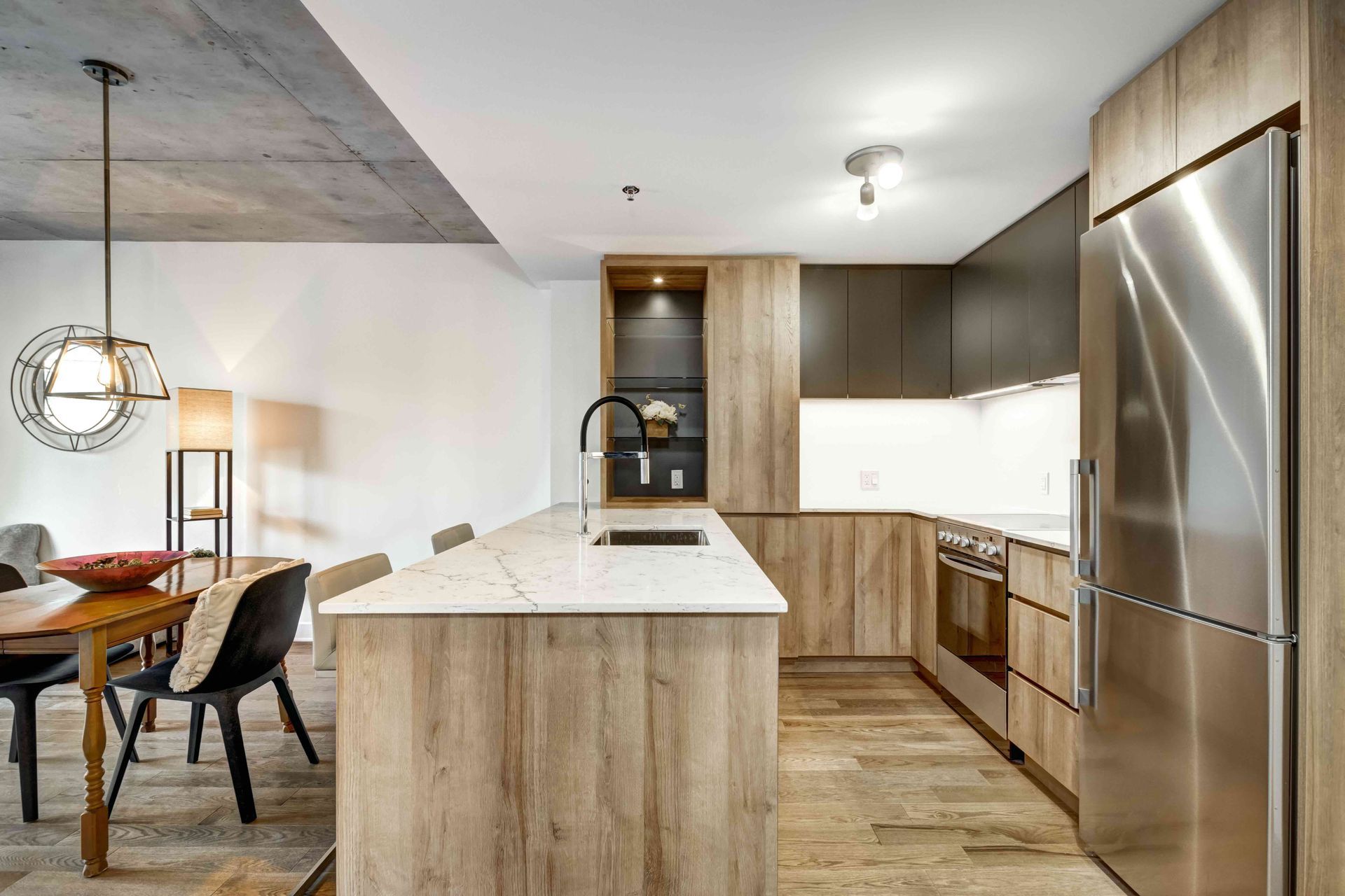 A kitchen with wooden cabinets and stainless steel appliances.