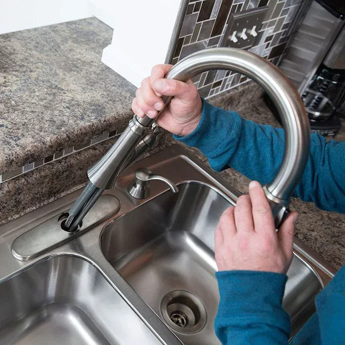plumber setting up gear